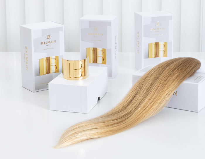 Loose Blonde Human hair weft. Picture taken in Studio in front of Balmain hair products